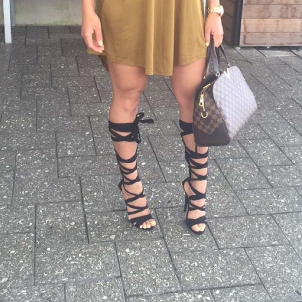 Thigh high strappy heels